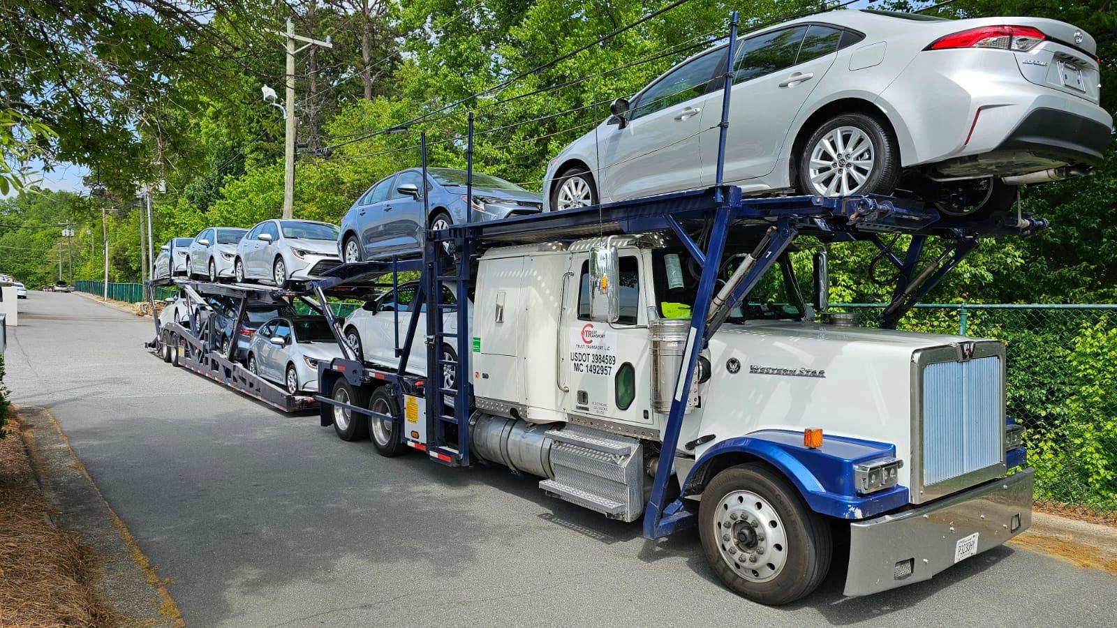 Trust Transport LLC hauling cars to Denver